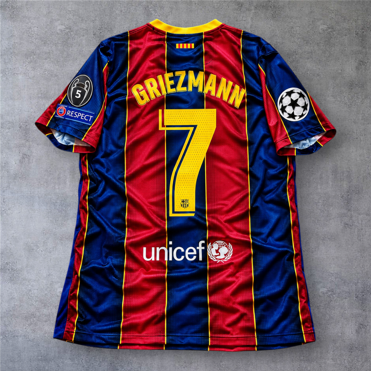 Camisola oficial A minha loja do Barcelona 2020/21, modelo Griezmann 7, com emblemas da Champions League nas mangas.
