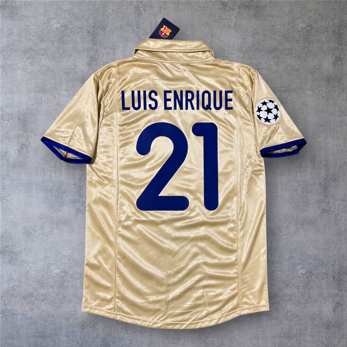 Camisola de futebol A minha loja do Barcelona 2001/02 fora, dourada, com nome Luis Enrique e número 21 nas costas.