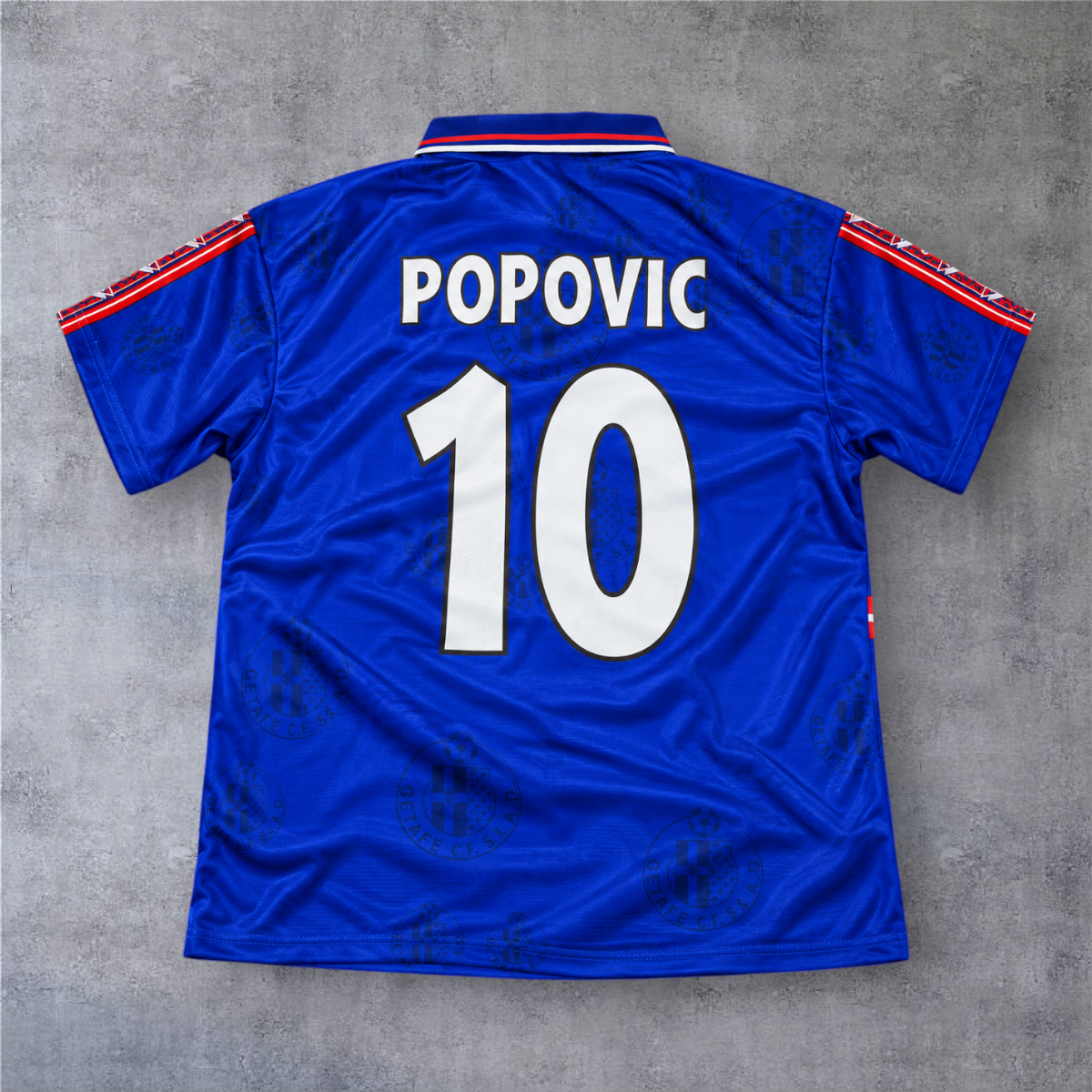 Camisola de futebol A minha loja Getafe 1998/99 azul com o nome Popovic e o número 10 nas costas
