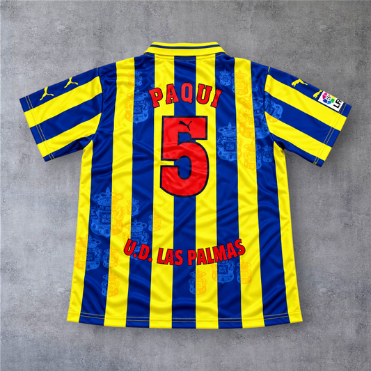 Camisola A minha loja Las Palmas 1998/99 de Paqui com o número 5, em riscas verticais azuis e amarelas.