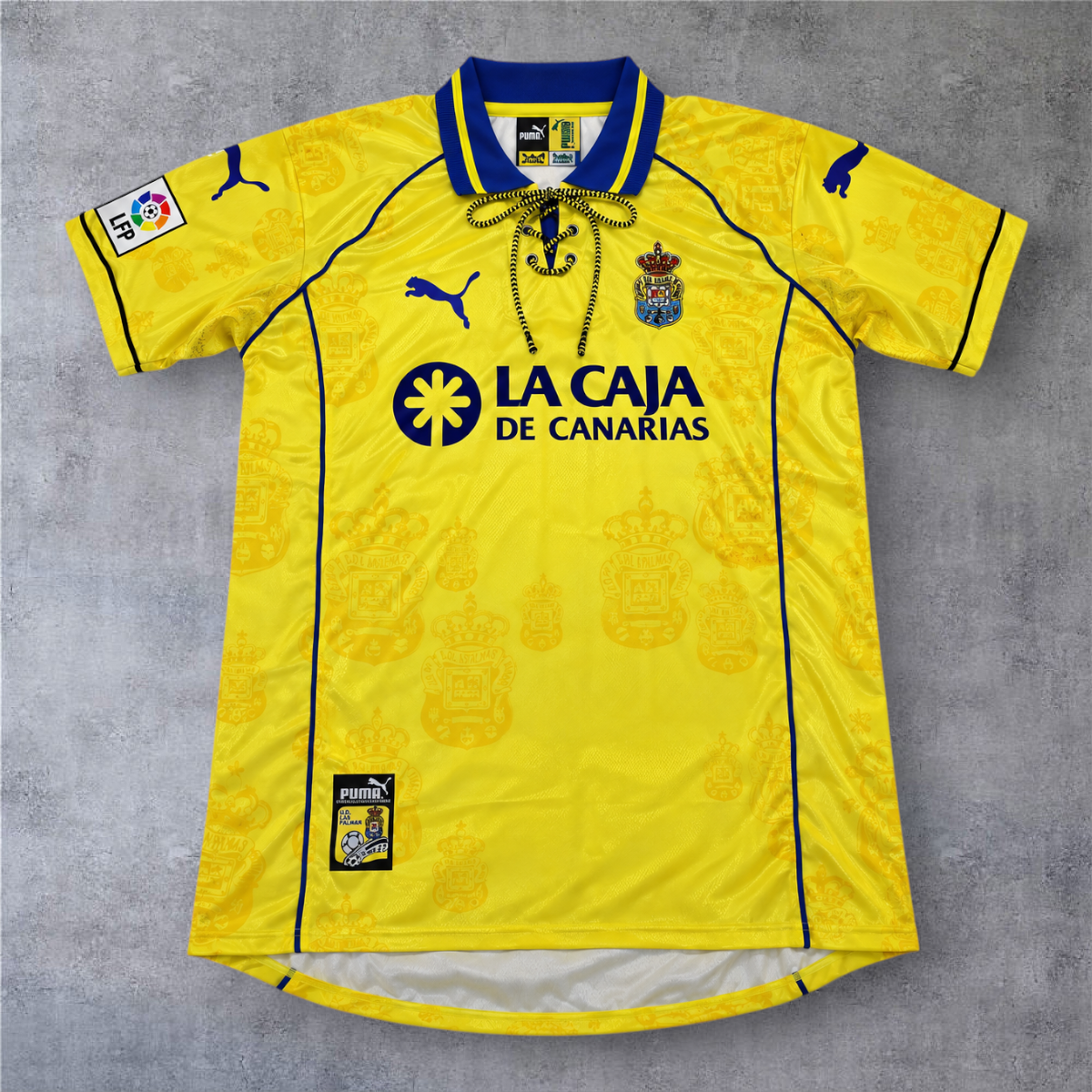 Camisola de futebol A minha loja Las Palmas 1997/98 amarela com gola de cordões e detalhes em azul