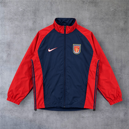 Casaco vintage Arsenal 1998/99 da A minha loja, azul e vermelho com fecho completo e logótipo da Nike.