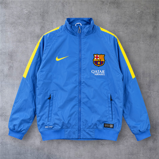 Casaco vintage A minha loja do Barcelona 2015/16 azul com detalhes em amarelo, fecho completo e logótipos bordados.