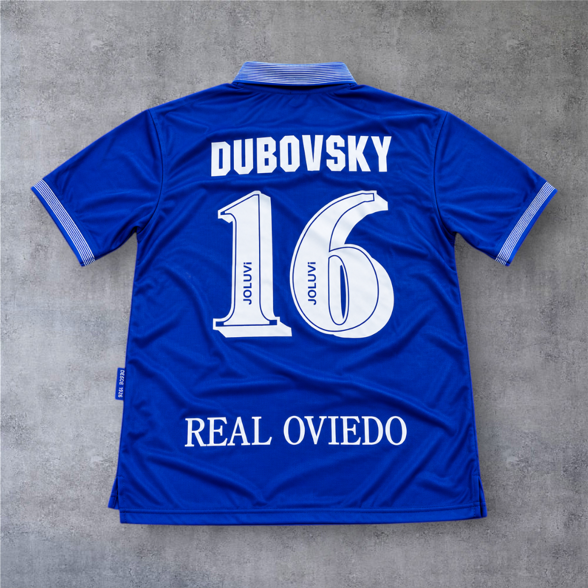Camisola de futebol A minha loja do Real Oviedo 1996/97, azul, com o nome Dubovsky e o número 16 nas costas.