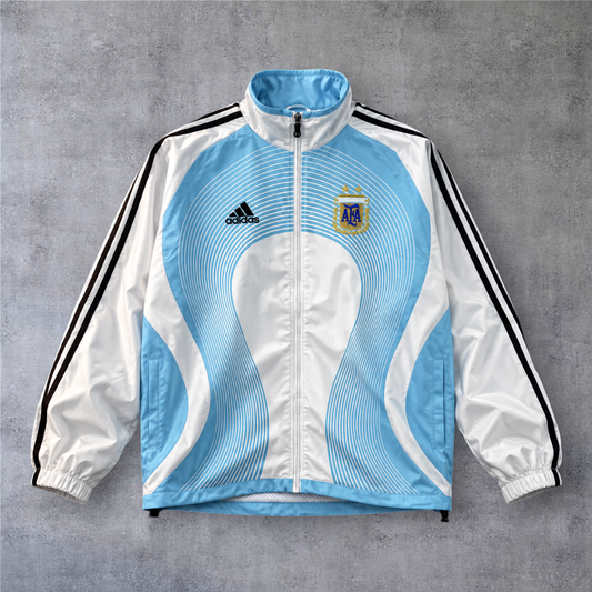 Casaco vintage da Argentina 2006 A minha loja, branco e azul claro com fecho frontal e detalhes desportivos.
