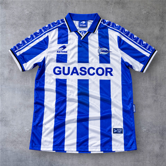 Camisola de futebol A minha loja Desio 16 Alavés 1998/99 às riscas azuis e brancas com gola e logótipo Astore