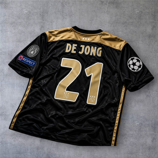 Camisola A minha loja do Ajax 18/19 Champions League, preta e dourada, com o nome De Jong e o número 21 nas costas.