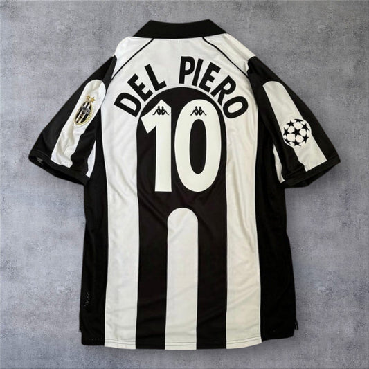 Camisola de futebol A minha loja Juventus 1997/1998, modelo casa, com o nome Del Piero e número 10 nas costas.
