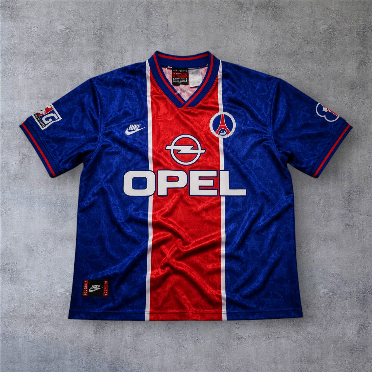 Camisola de futebol A minha loja PSG 1994/95 home azul e vermelha com patrocinador Opel e detalhes em relevo