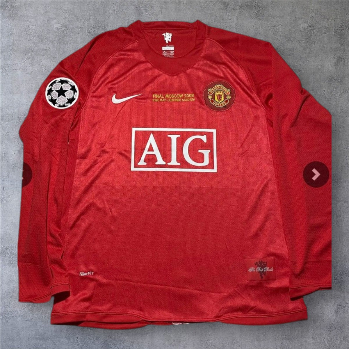 A minha loja Manchester United 2007/08 Champions League Final camisola vermelha de manga comprida com AIG no peito.
